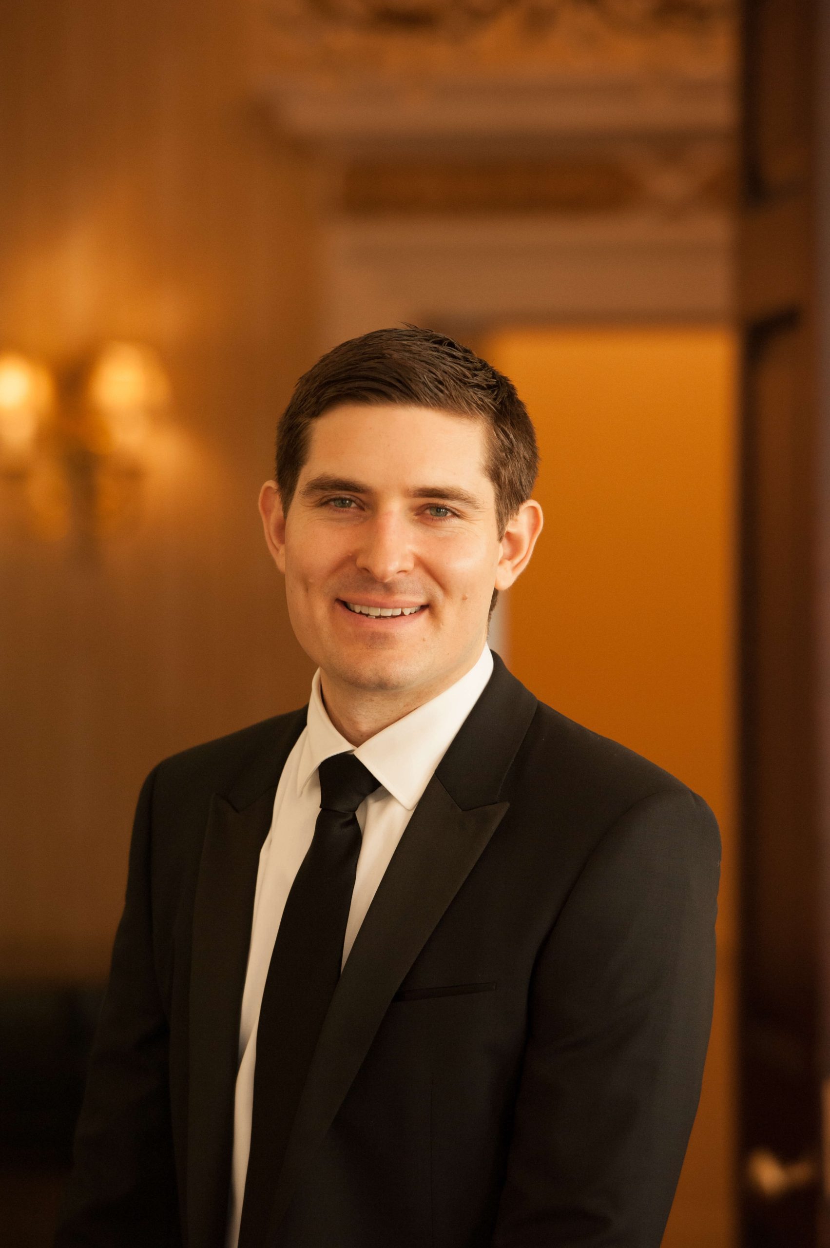 groom in formal black suit and tie