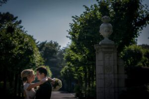 bride and groom embracing in gardens