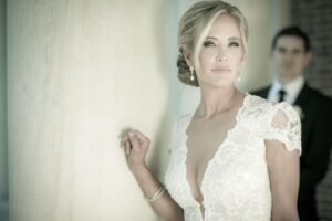 bride with groom blurred in the background