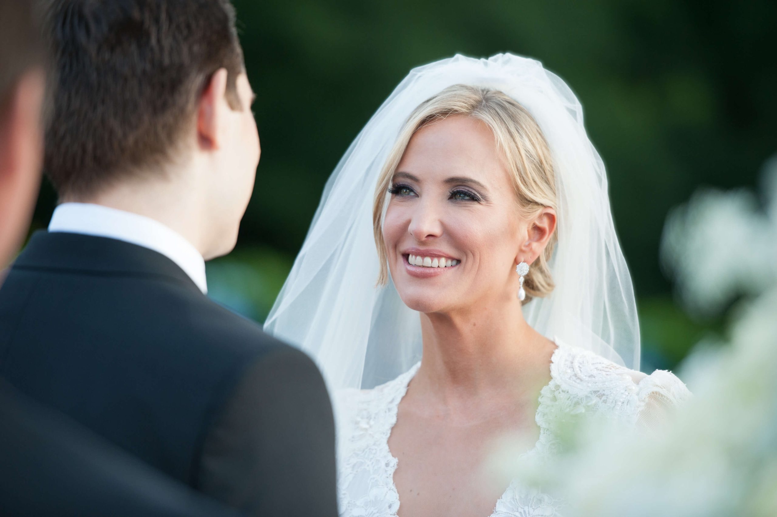bride looks at groom during wedding ceremony