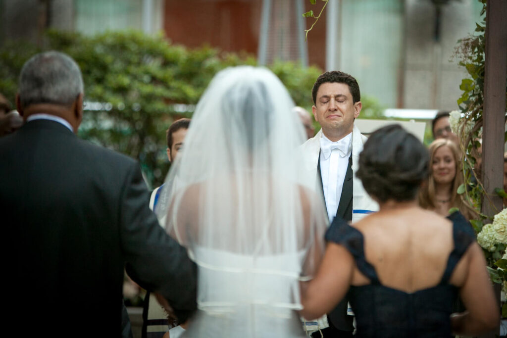 groom crying at wedding ceremony