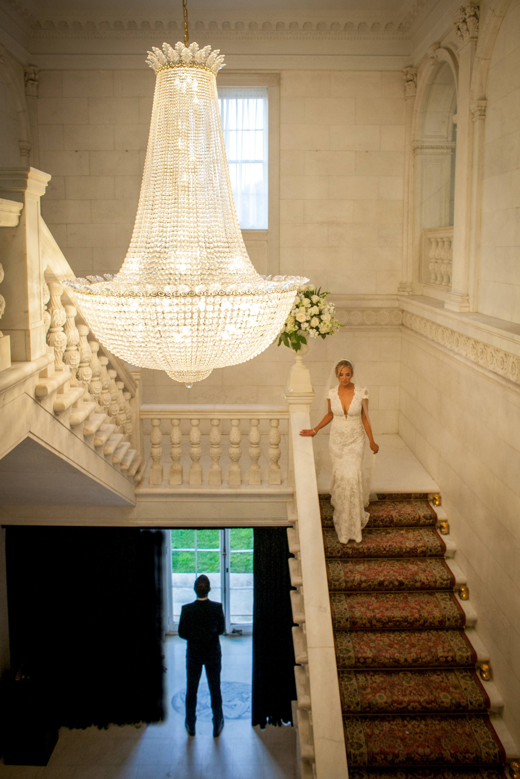 bride and groom at staircase on wedding day