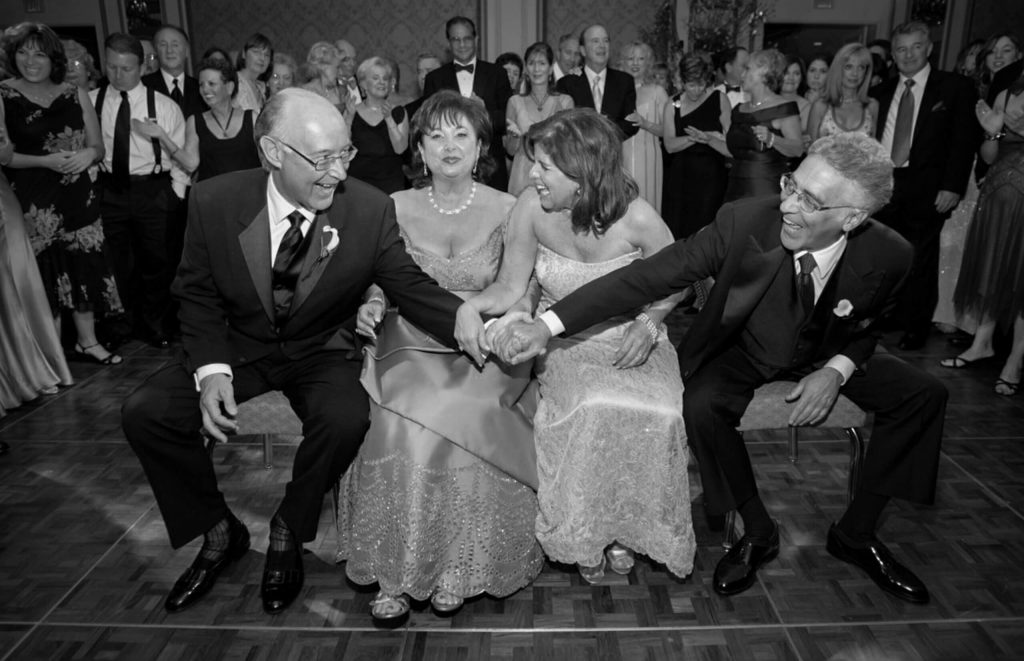 laughing parents at sitting on dance floor