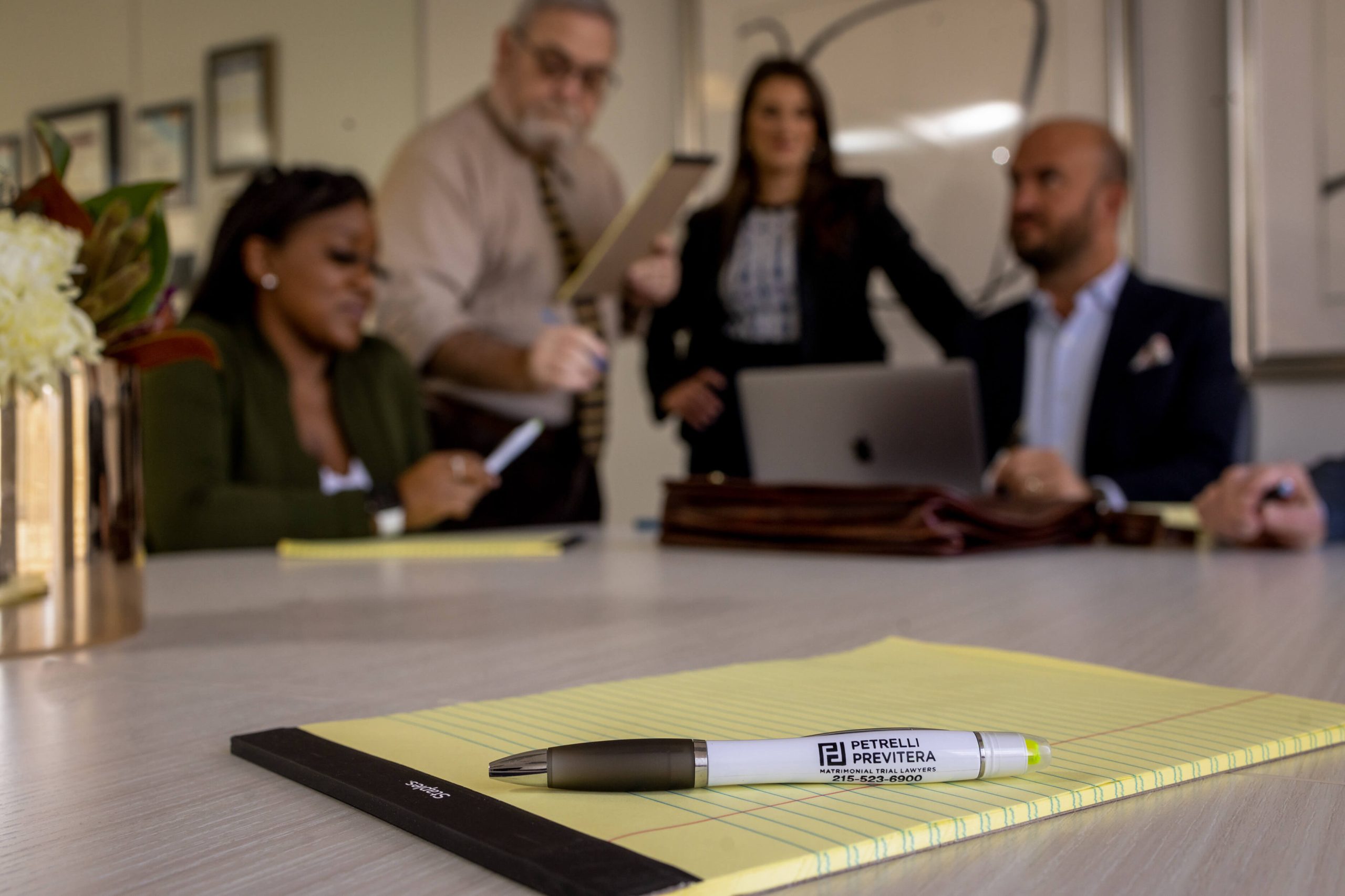 lifestyle photography with corporate team and branded pen