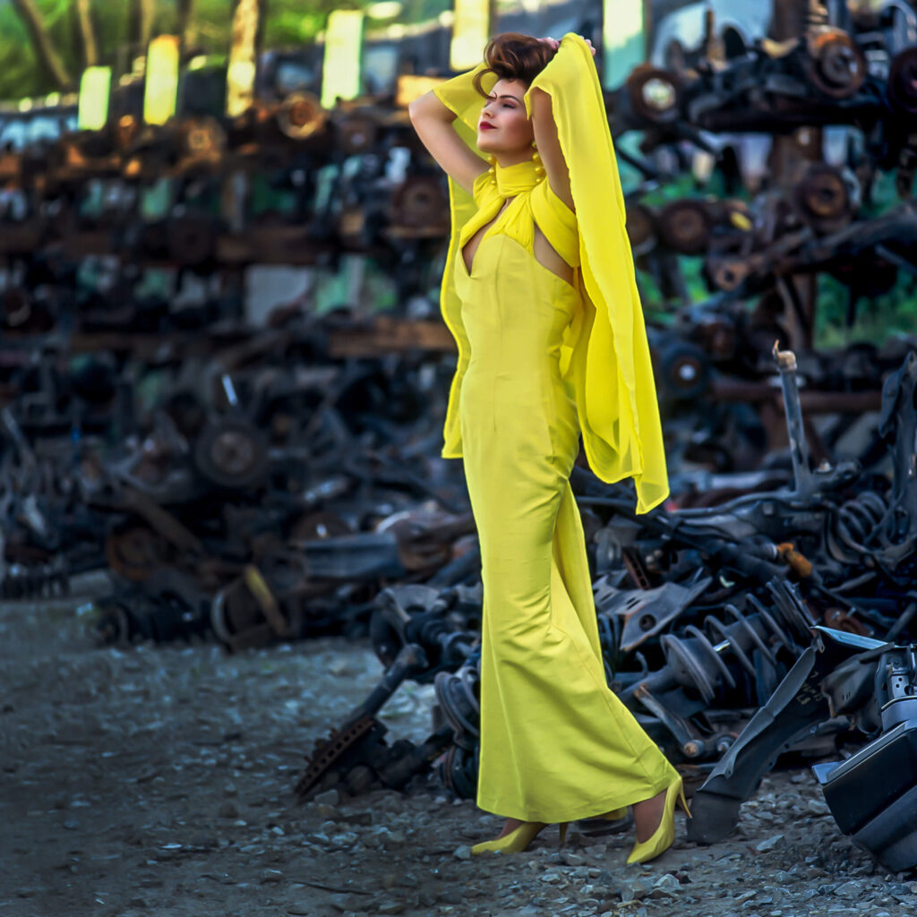 woman wearing yellow dress in scrap yard