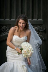 bride laughing in wedding dress