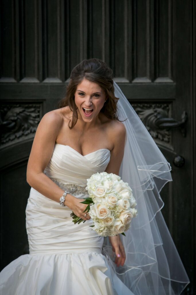 bride laughing in wedding dress