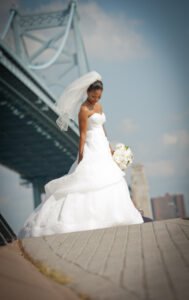 bride in wedding dress with blue bridge