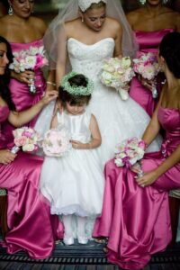 bridesmaids brush flower girl's hair