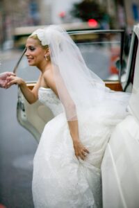 bride getting out of a car
