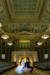 bride and groom sitting on chairs