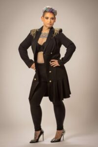 woman holding her hips with serious expression