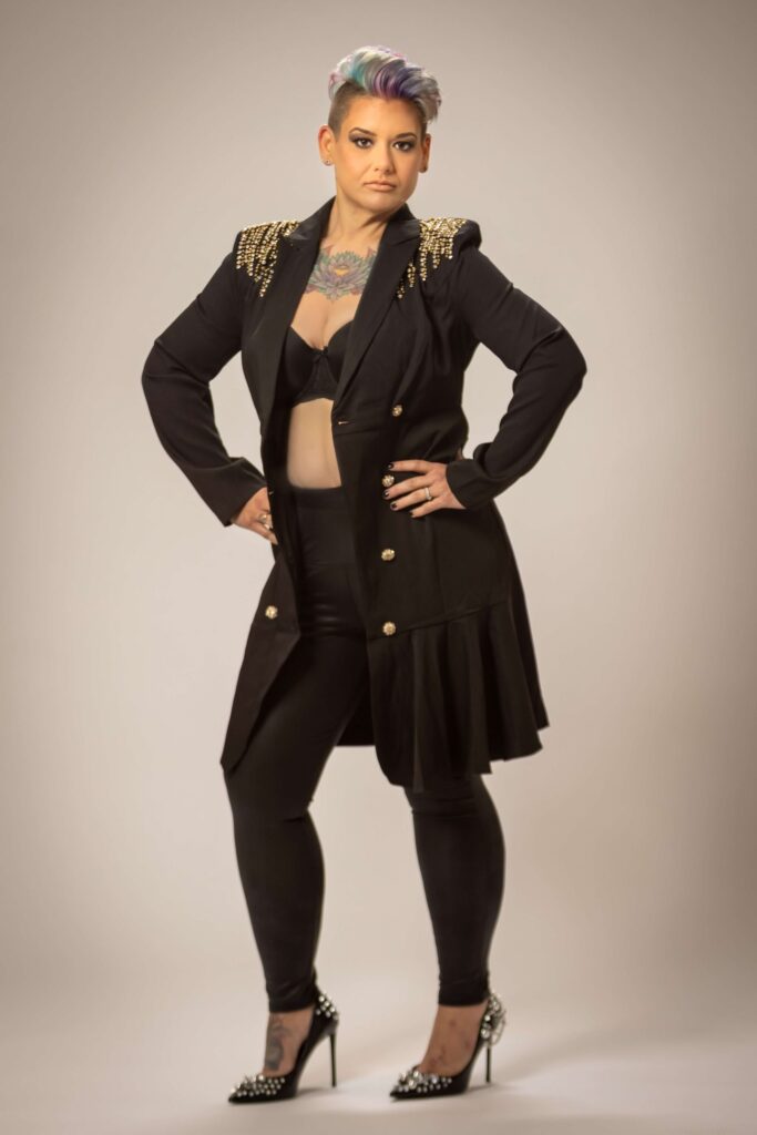 woman holding her hips with serious expression