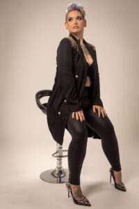 woman sitting on a black stool