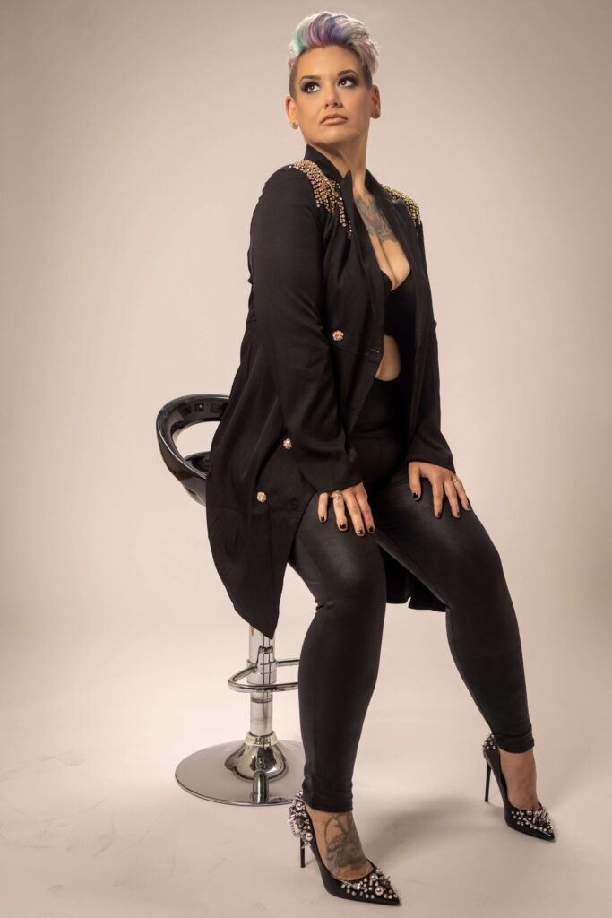 woman sitting on a black stool