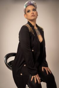 woman sitting on a black stool