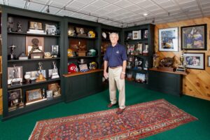 dick vermeil standing in trophy room