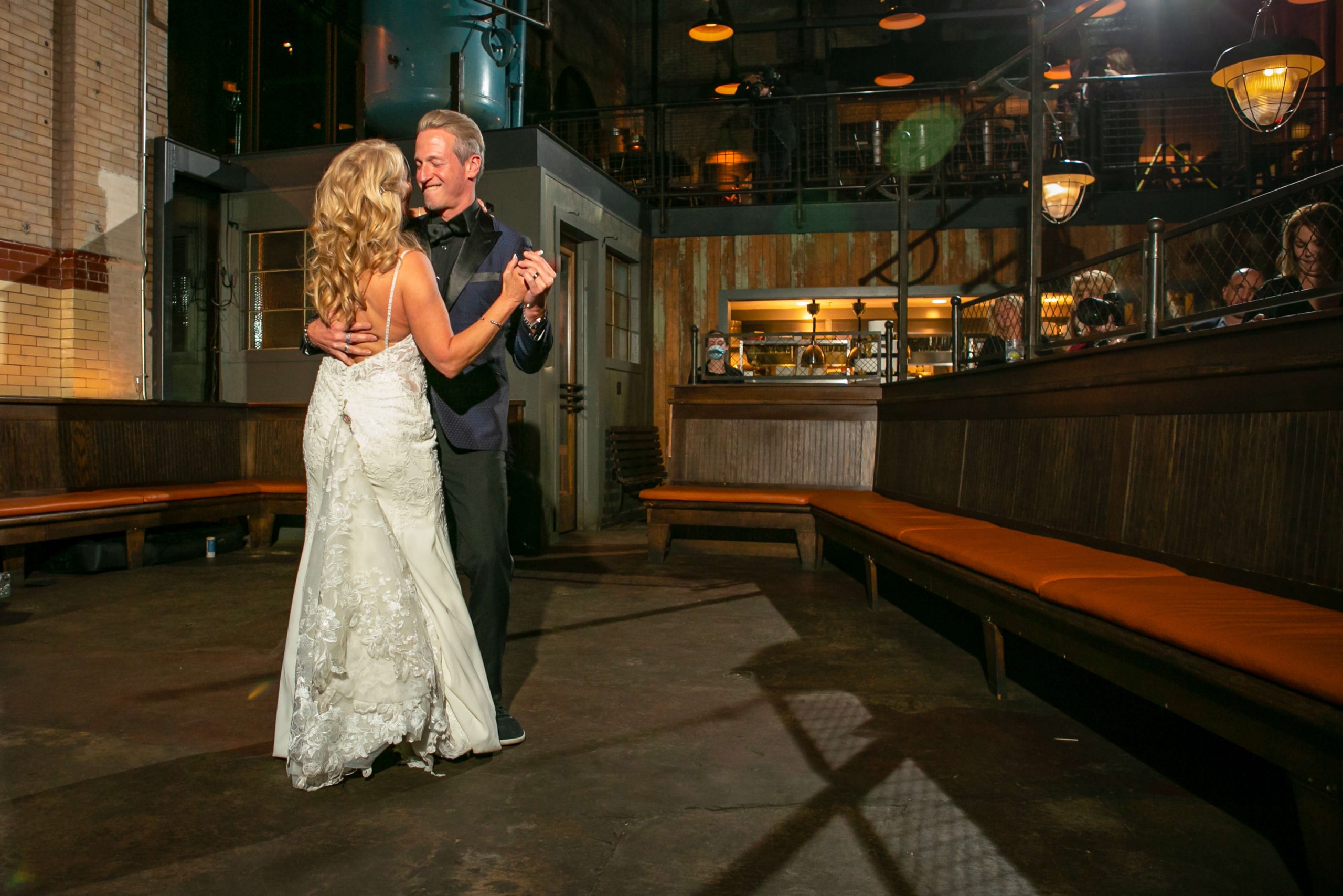 four people sitting at steps of historic American building