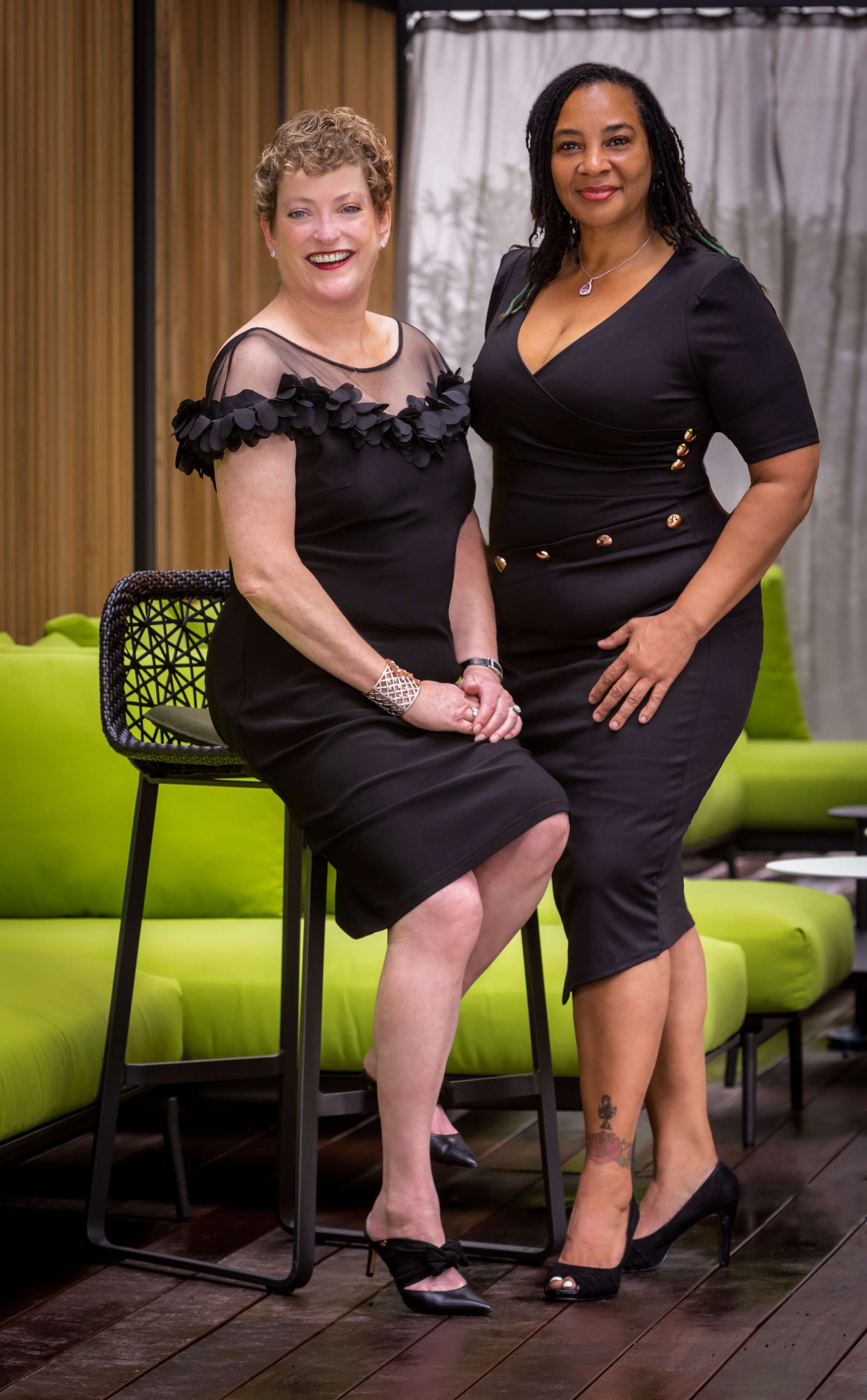 fashionable woman posing with large circus mask art