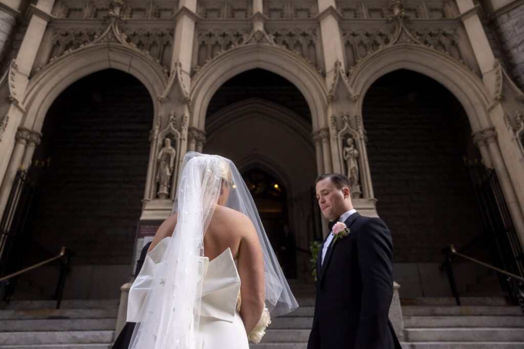 bride enters catholic church on wedding day