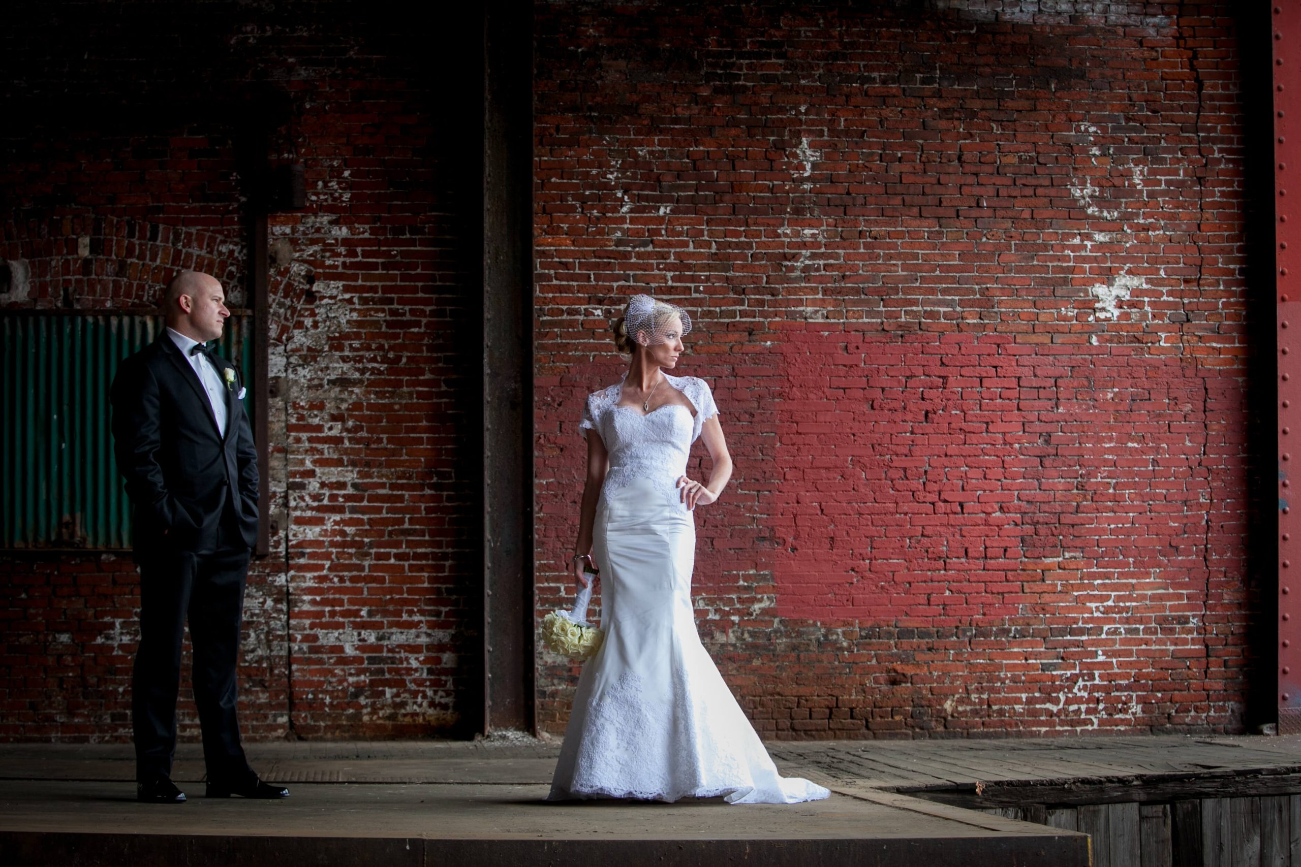 bride and groom in industrial urban warehouse