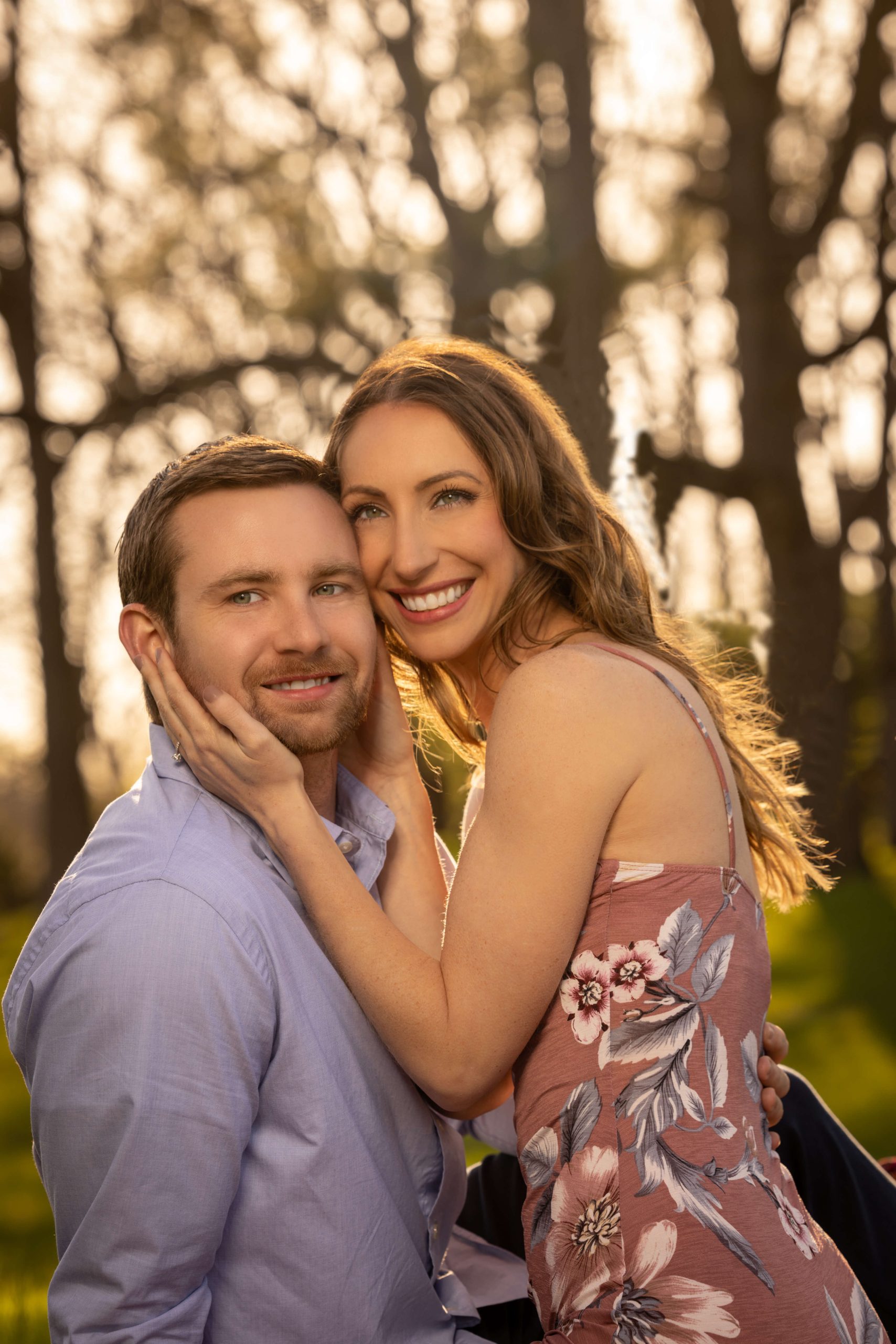 woman in a blue dress by the fireplace