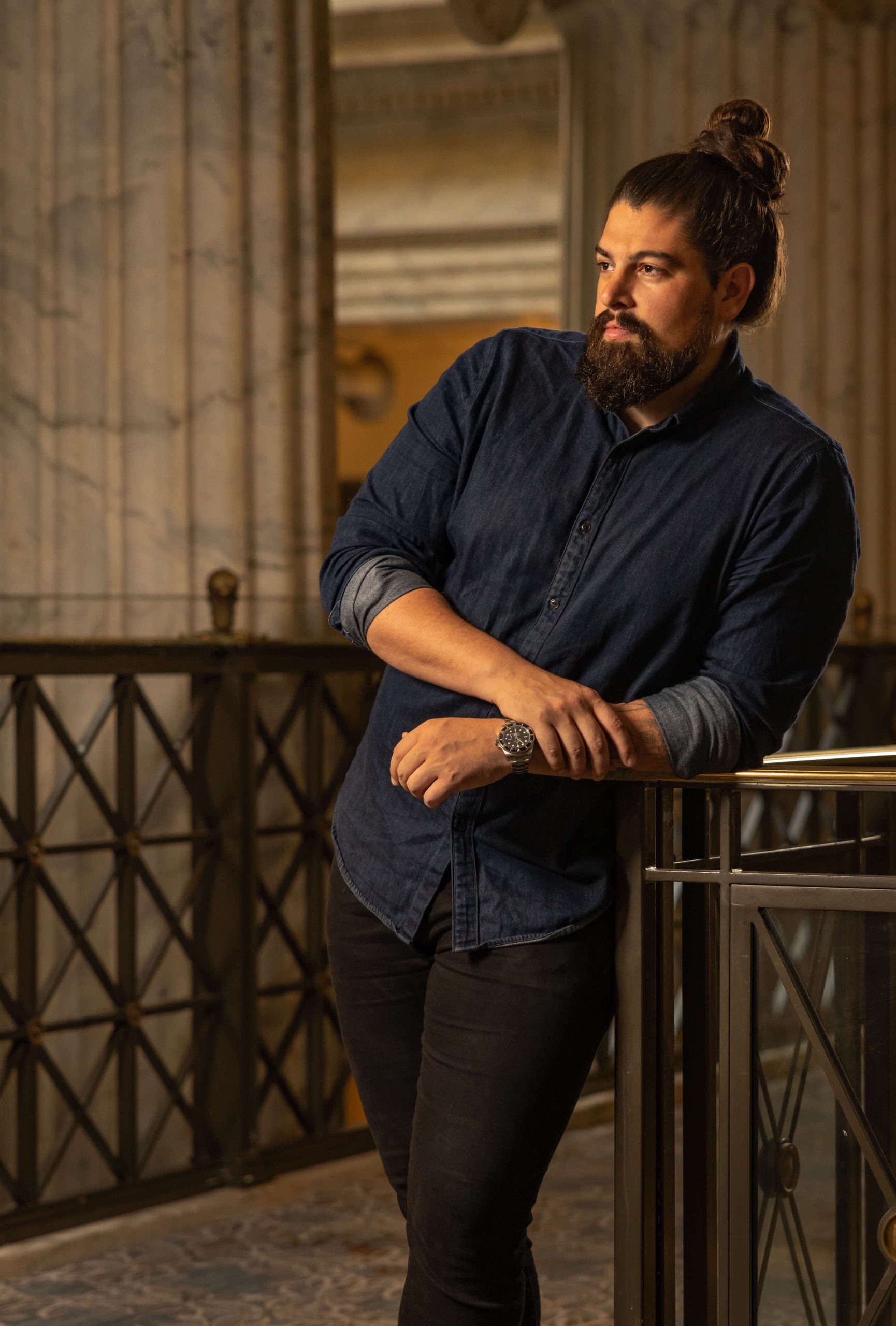 woman wearing pink dress and holding a book