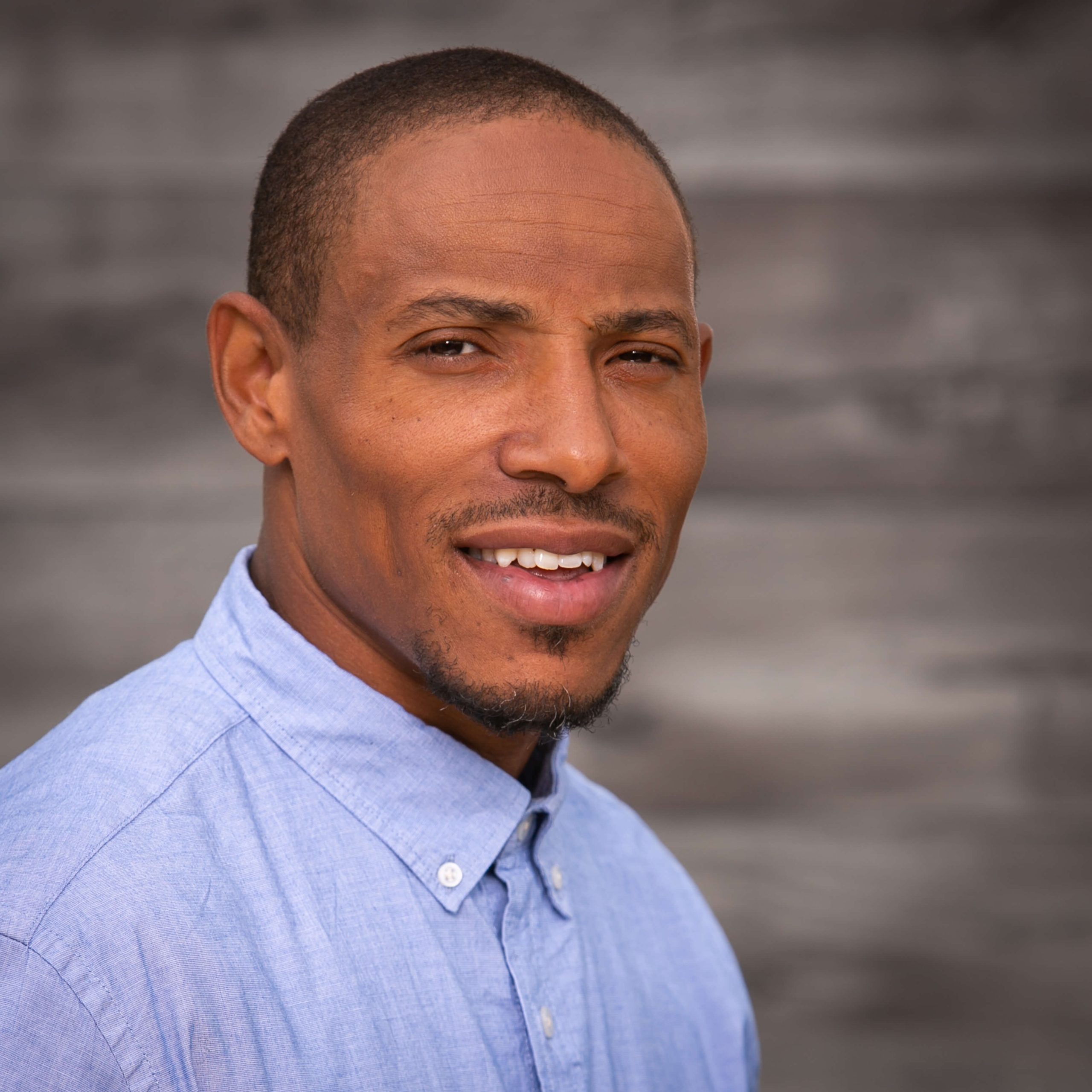 tattooed woman sitting on box in studio