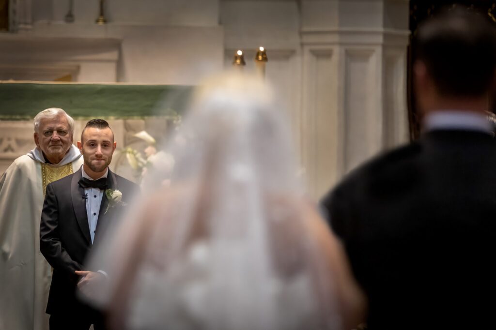 groom cries as bride walks down aisle