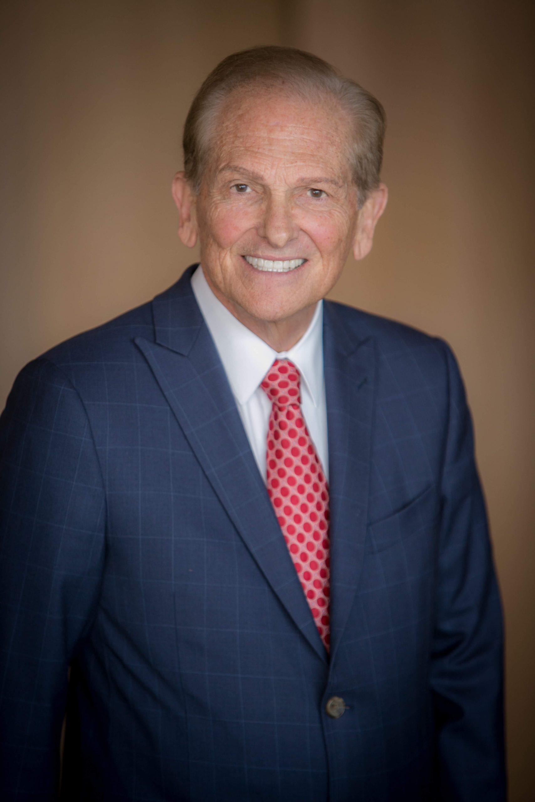 man wearing a classy blackwatch suit