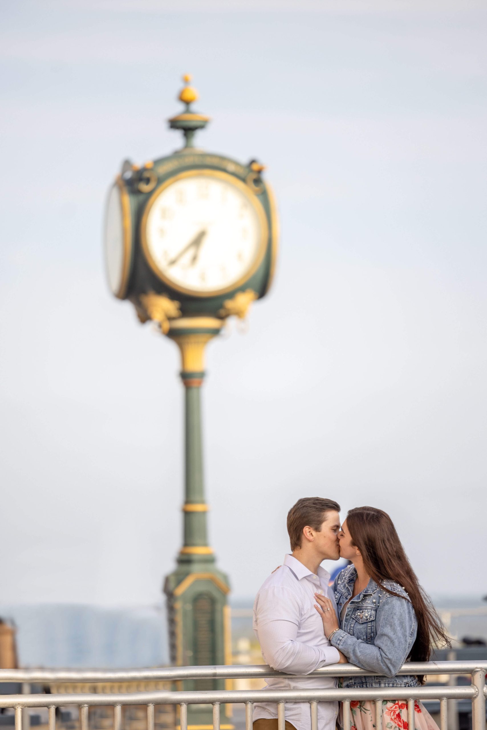 couple kissing by clock in ocean city new jersey