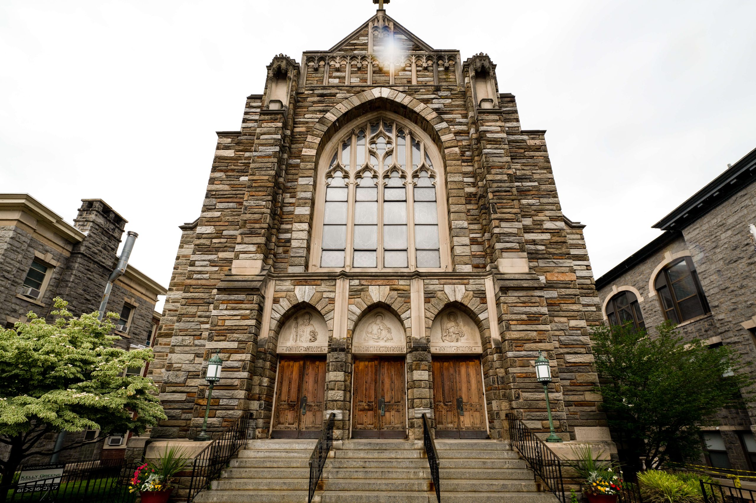 stone catholic church on overcast day