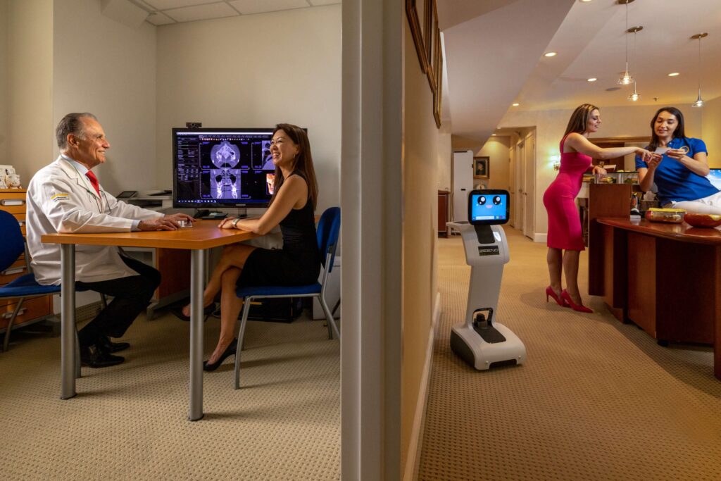dentist in meeting room with patient at dental practice
