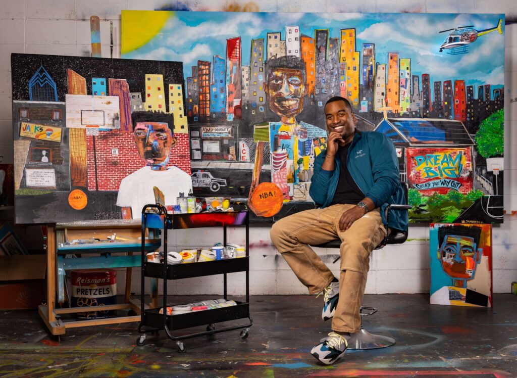 man sitting on stool in art studio