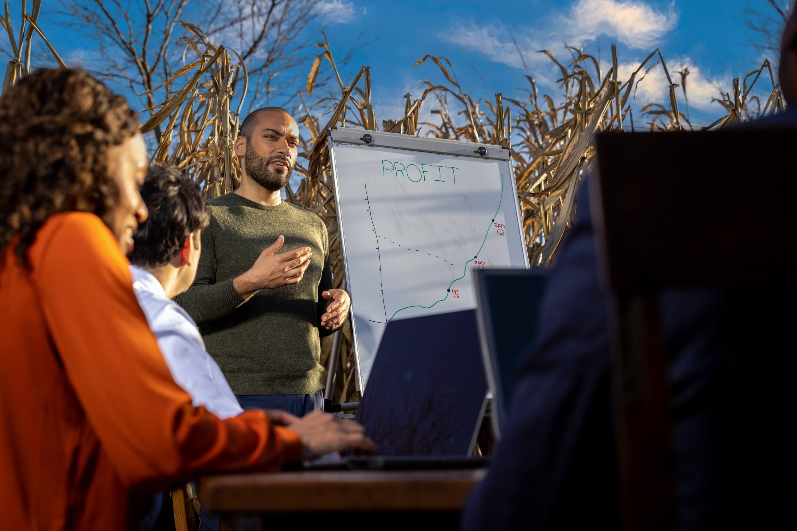 business presentation with dry erase board in cornfield