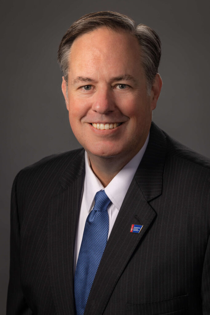 corporate businessman smiling in a suit