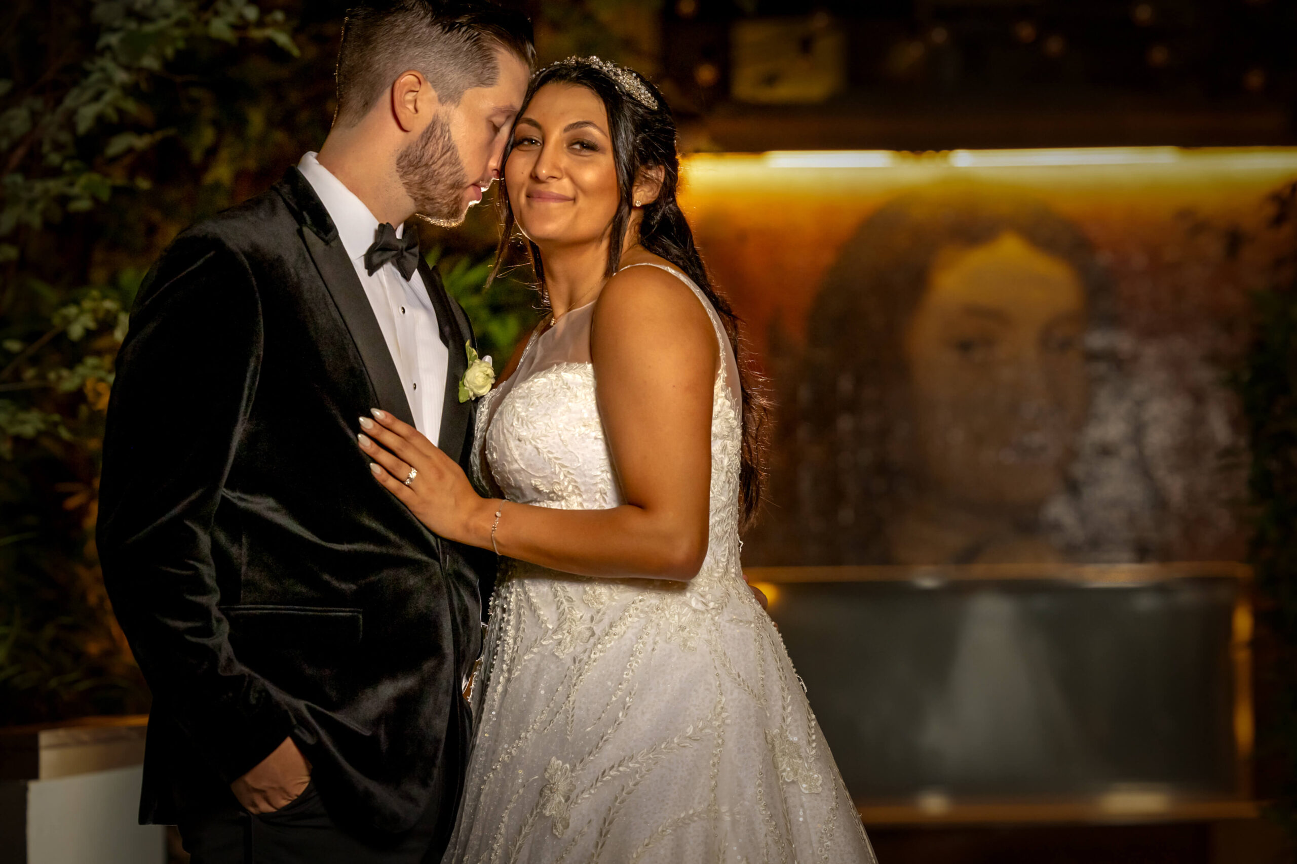 bride and groom embracing at w hotel secret garden in philadelphia