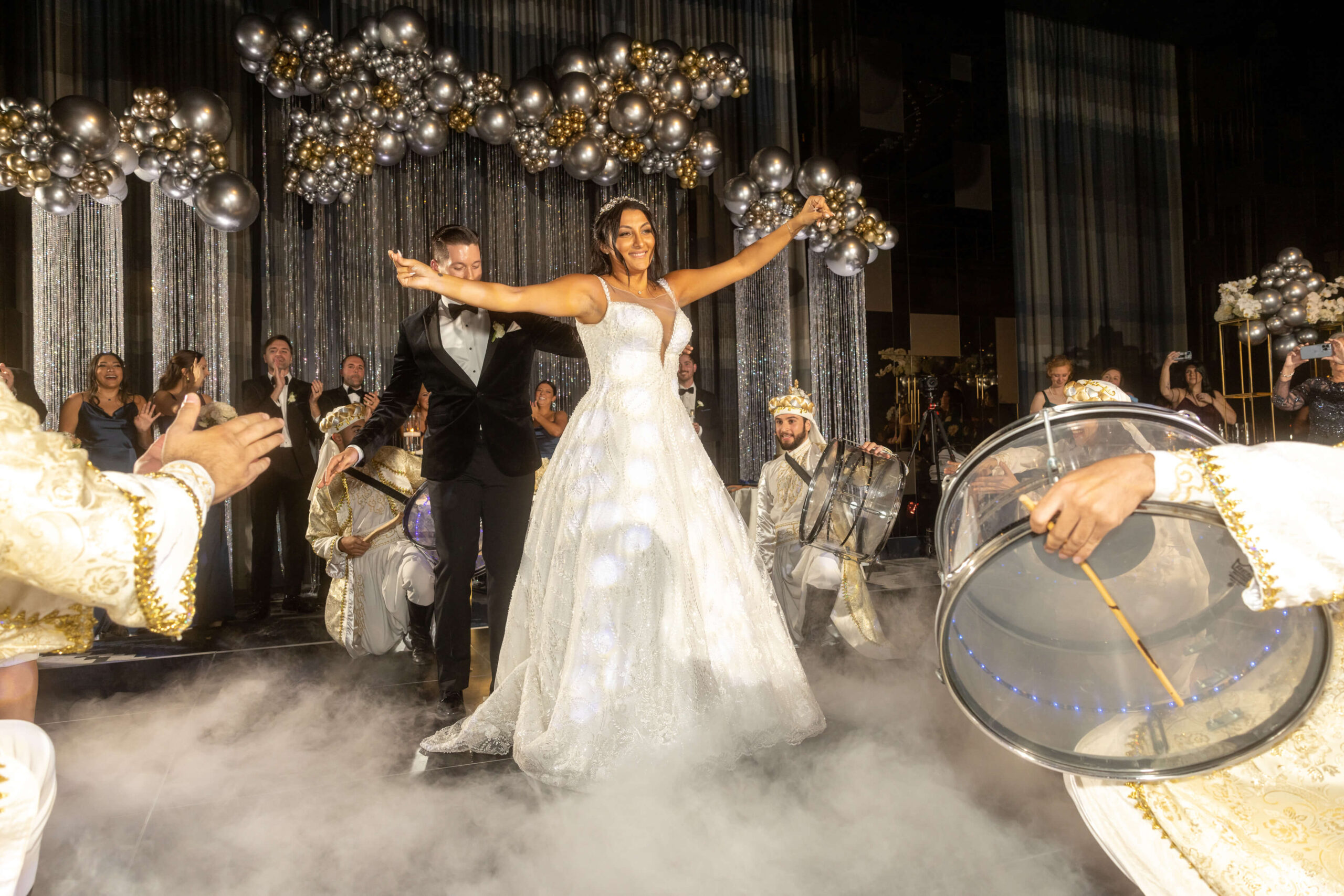 bride and groom sitting at sweetheart table