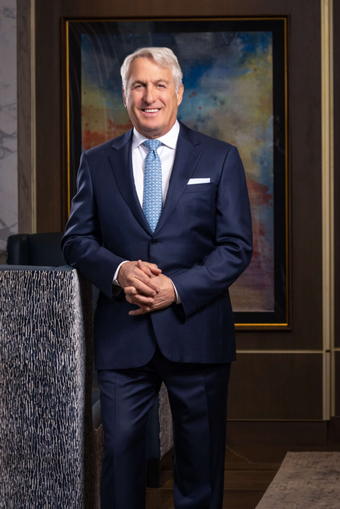 man in classic navy blue suit in elegant condo lobby