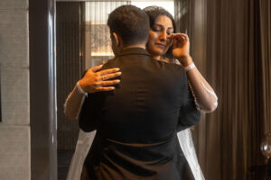 bride crying while hugging sibling at w hotel in philly