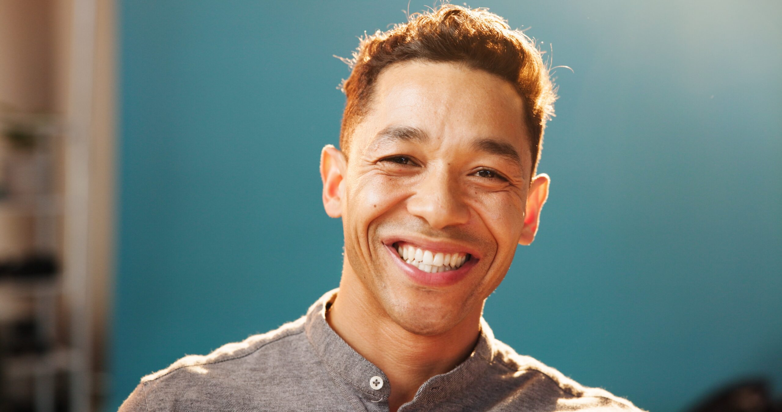 barbara majeski leaning on brown chair in modern living room