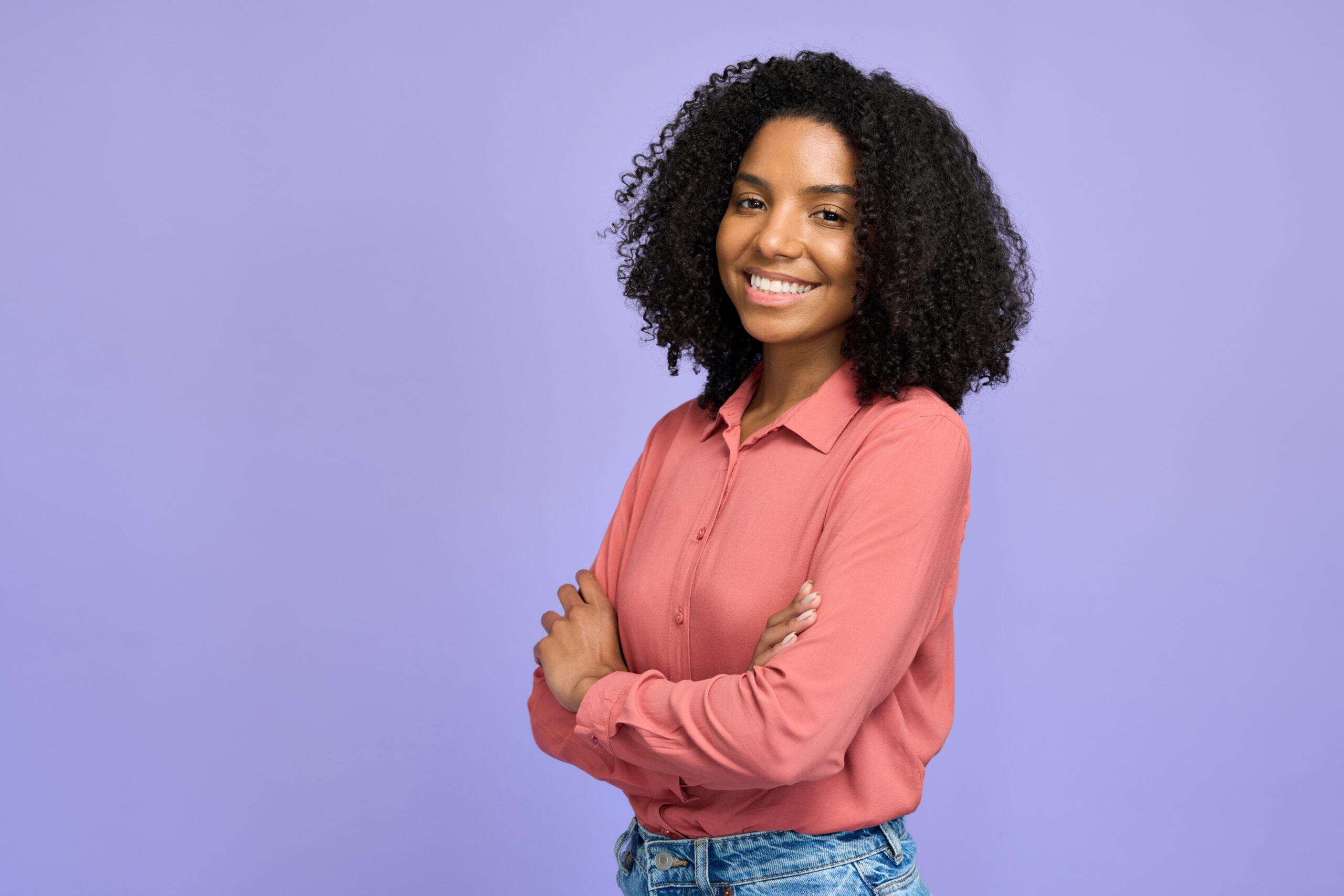 woman wearing blue dress and sitting in brown chair at guild house hotel
