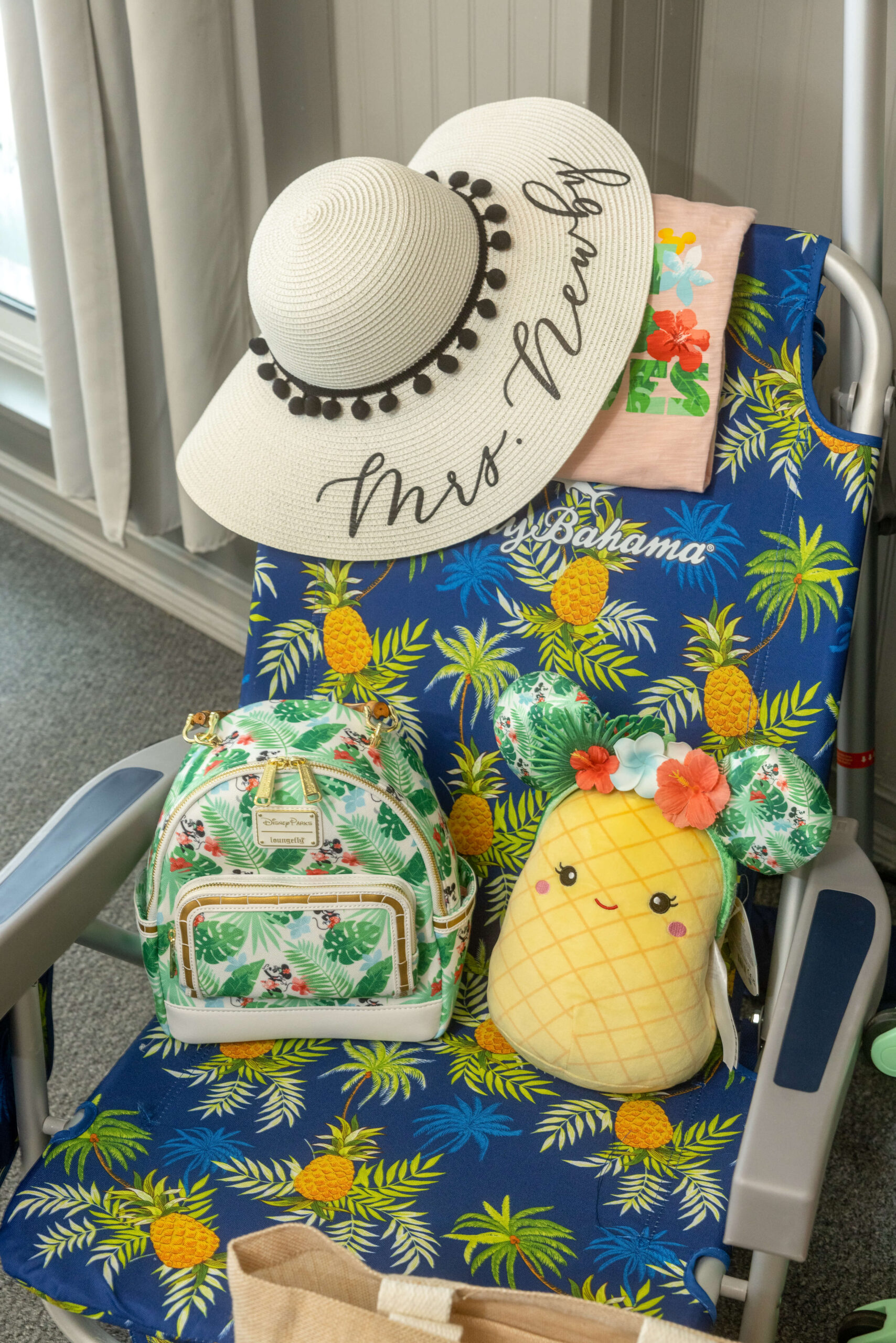custom sun hat, tropical beach chair and backpacks at a bridal shower