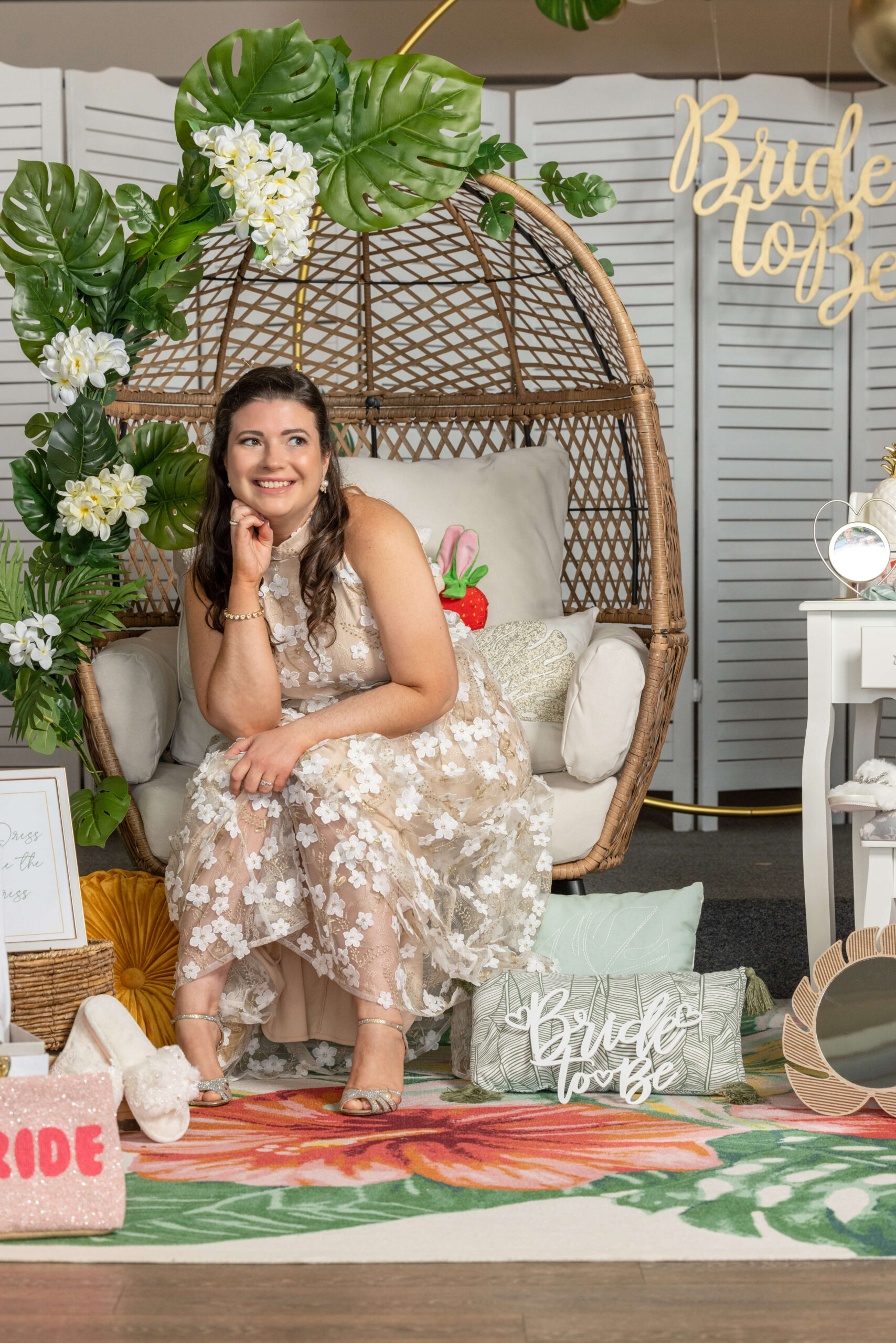 bride at tropical bridal shower blowing a kiss into full-length mirror