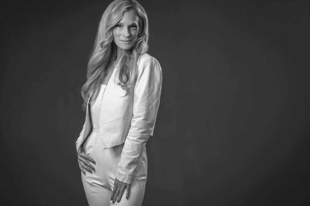 consuelo vanderbilt costin posing with hands on hips in a photo studio