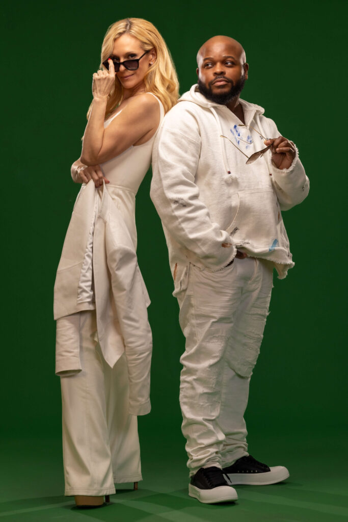 blonde woman lifting down sunglasses and man holding his own pair of sunglasses against green background