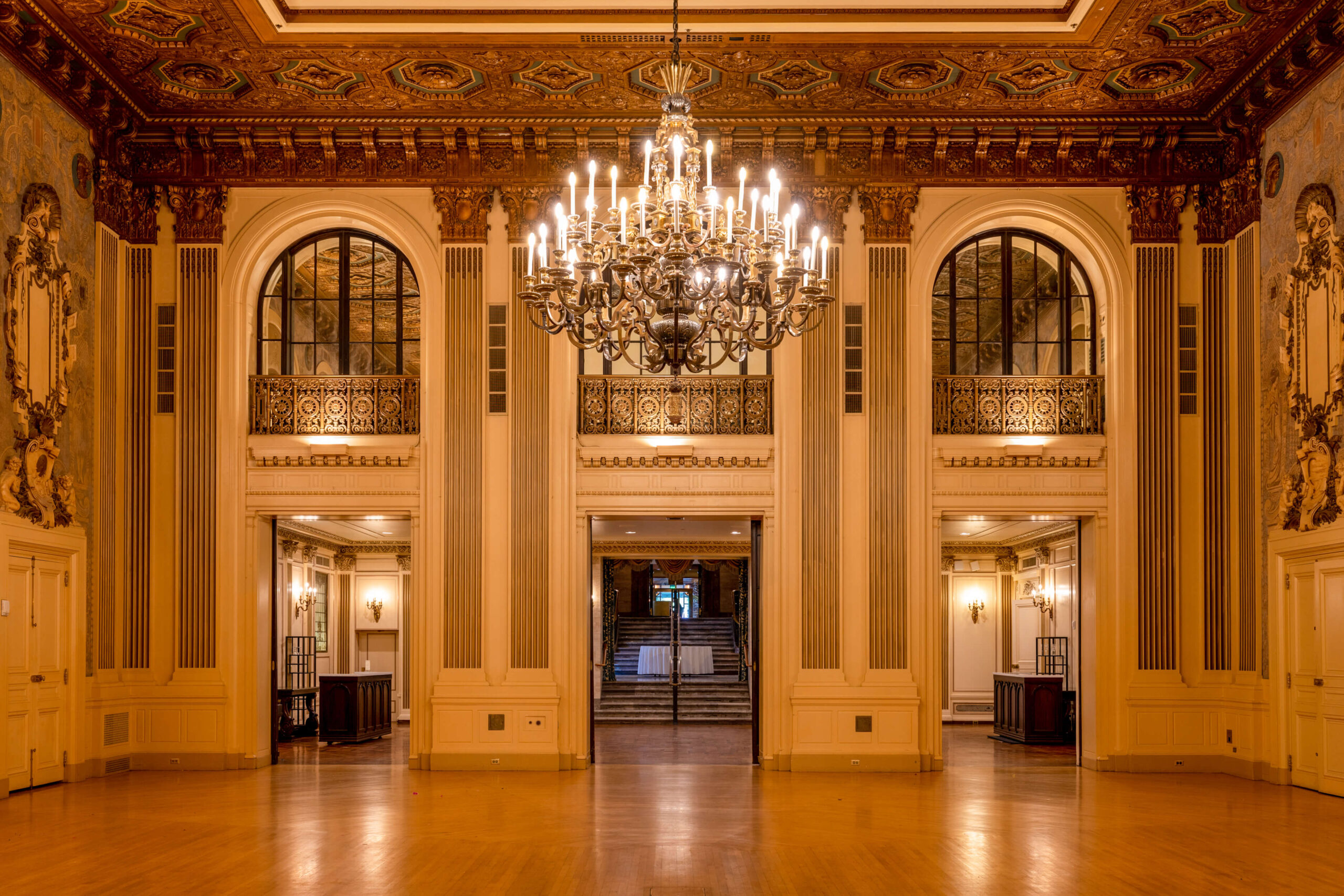 dramatic interior of lavish gold ballroom at hotel du pont with chandelier