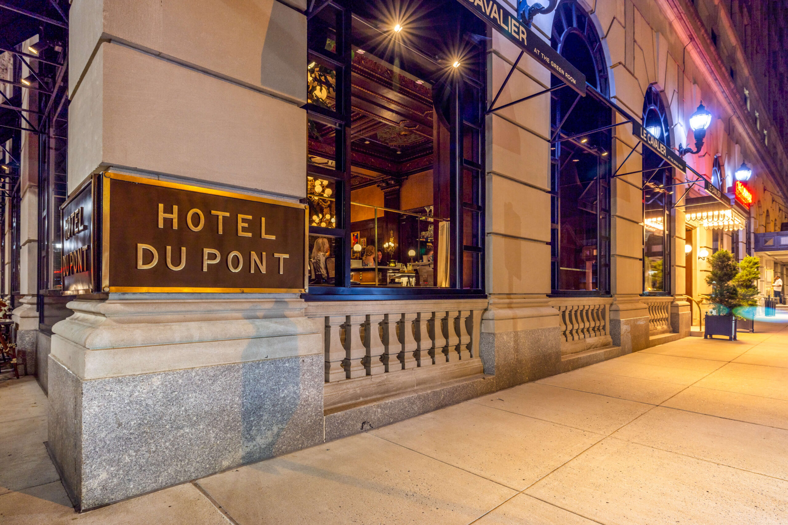 bride posing and appreciating at wedding dress details
