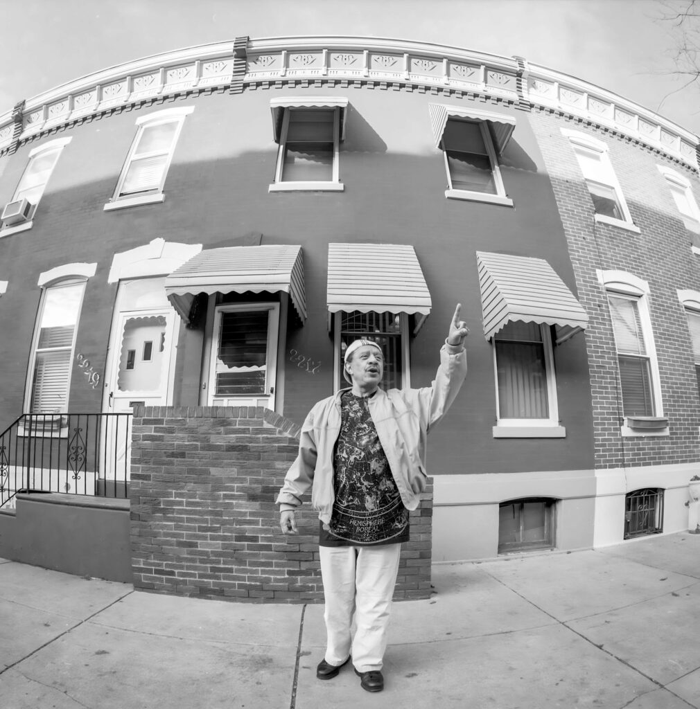 sherman hemsley pointing to the sky