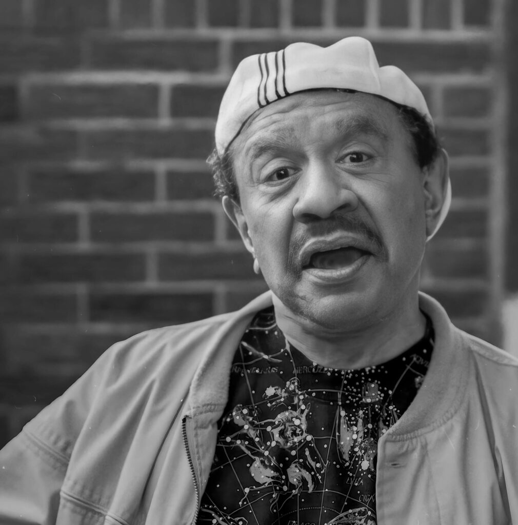 sherman hemsley striking a funny face expression